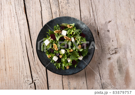 Beetroot salad with feta cheese,lettuce and walnuts Beetroot salad with feta cheese,lettuce and walnuts 83879757