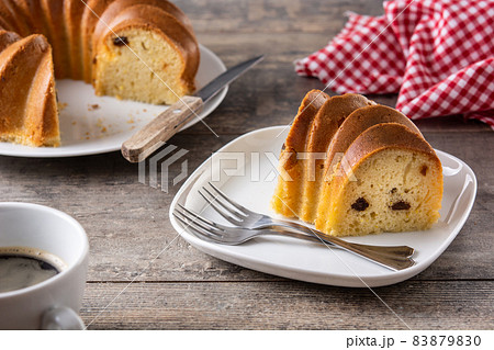 Traditional bundt cake piece with raisins Traditional bundt cake piece with raisins 83879830