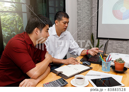 Business team meeting and discussing project plan. Businessmen discussing together in meeting room. Professional investor working with business project together. Finance managers task. 83883528