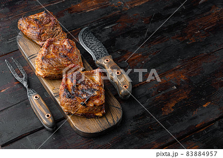 Grilled beef short rib, on old dark wooden table background, with copy space for text 83884957