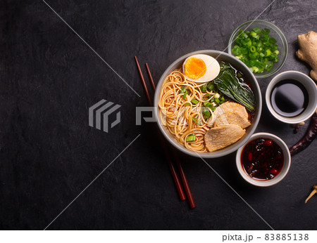 Ramen is asian noodles in a bowl with meat and vegetables or seafood with copy space 83885138