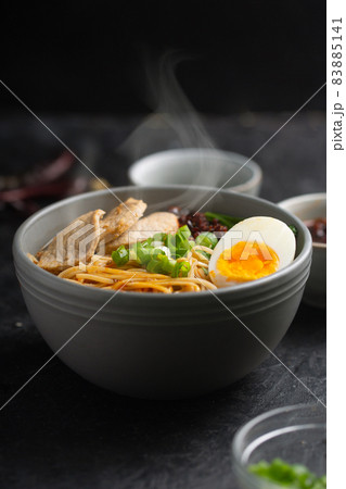 Ramen is asian noodles in a bowl with meat and vegetables or seafood Ramen is asian noodles in a bowl with meat and vegetables or seafood 83885141