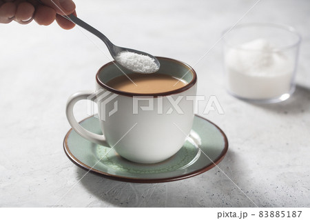 Man making coffee with milk and sweetener 83885187