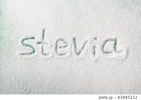 Scattered organic stevia powder sweetener with lettering Scattered organic stevia powder sweetener with lettering 83885212