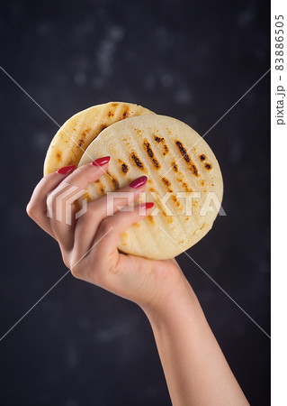 Traditional Venezuelan food arepa made from cornmeal Traditional Venezuelan food arepa made from cornmeal 83886505