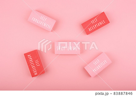 Mental health and self love concept. Self forgiveness, appreciation,acceptance and prioritize written on rectangles on pink background 83887846