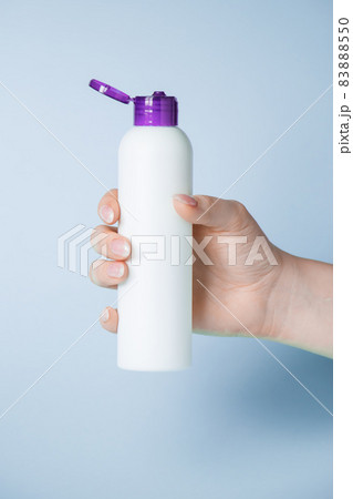 Disinfectant bottle in the hand. Coronavirus prevention, health protection concept. Disinfectant bottle in the hand. Coronavirus prevention, health protection concept. 83888550