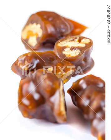 Tasty oriental sweets, churchkhela on white background. Georgian national dessert Tasty oriental sweets, churchkhela on white background. Georgian national dessert 83896907