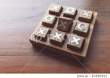 Vintage Tic Tac Toe wooden board game on wooden top table Vintage Tic Tac Toe wooden board game on wooden top table 83896991