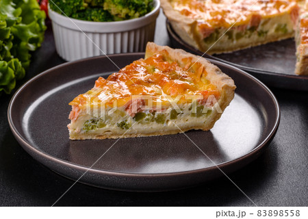 Delicious fresh quiche with broccoli, salmon and cheese Delicious fresh quiche with broccoli, salmon and cheese 83898558