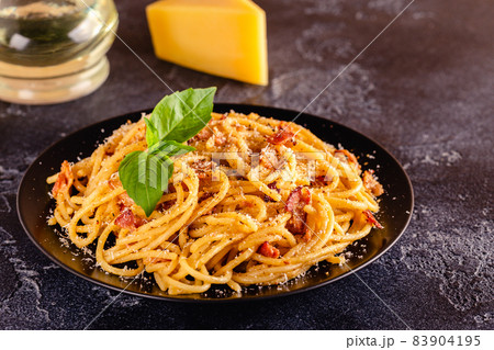 Homemade pasta with pancetta, egg, hard parmesan cheese and cream sauce Homemade pasta with pancetta, egg, hard parmesan cheese and cream sauce 83904195