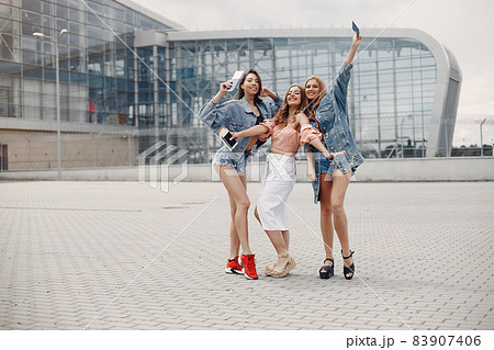 Elegant and stylish girls standing near the airport 83907406