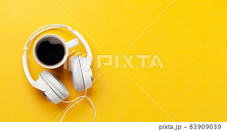 Headphones and coffee cup Headphones and coffee cup 83909039