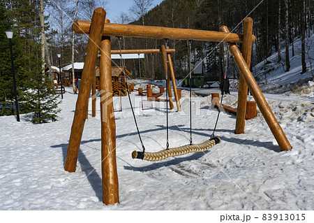 Childrens swing in the winter in the national park. Childrens swing in the winter in the national park. 83913015
