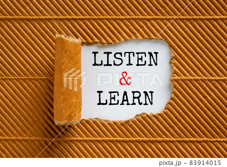 Listen and learn symbol. Words 'Listen and learn' appearing behind torn brown paper. Beautiful brown background. Business, educational and listen and learn concept, copy space. Listen and learn symbol. Words 'Listen and learn' appearing behind torn brown paper. Beautiful brown background. Business, educational and listen and learn concept, copy space. 83914015