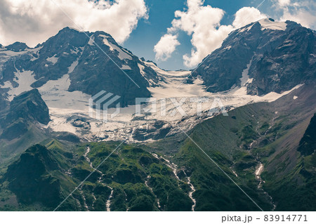 Glacier in the mountains of North Ossetia. Sharp peaks of the North Caucasus mountains 83914771