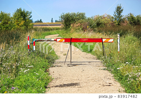 A walking path that has been closed off by barriers A walking path that has been closed off by barriers 83917482