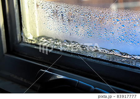 Ice and condensation forming on a window 83917777