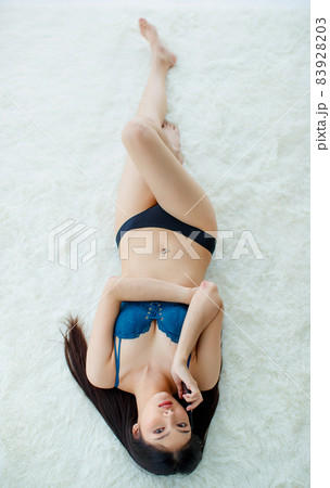 Beautiful young naughty slim Asian girl on sexy Stock Photo