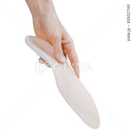 Orthopedic insole isolated on a white background. Medical insoles. Treatment and prevention of flat feet and foot diseases. Foot care, feet comfort. Wear comfortable shoes. Flat Feet Correction. 83932749