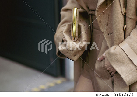 Milan, Italy - September 22, 2021:  Street style outfit, fashionable woman wearing a Fendi outfit on the streets of Milan, Italy. 83933374