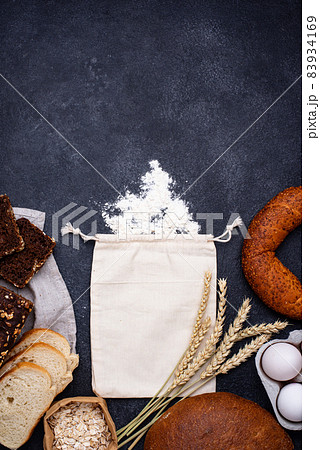 Baking concept with bread and flour Baking concept with bread and flour 83934169