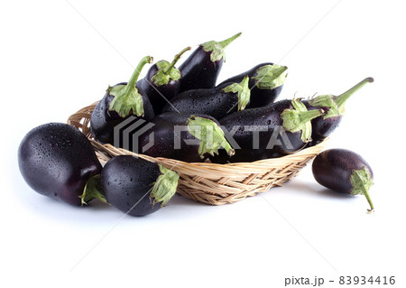 Eggplants on plate isolated on white Eggplants on plate isolated on white 83934416