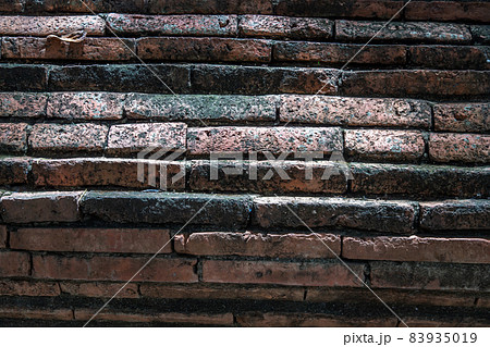Close-up of Cracked concrete vintage red brick wall background. 83935019