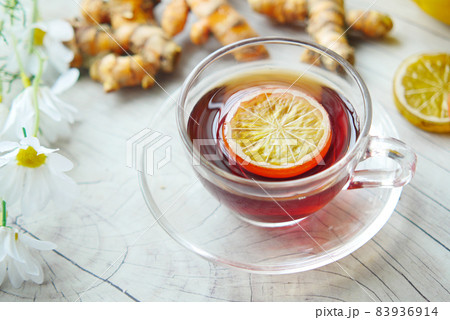Top view of ginger tea on wooden background. 83936914