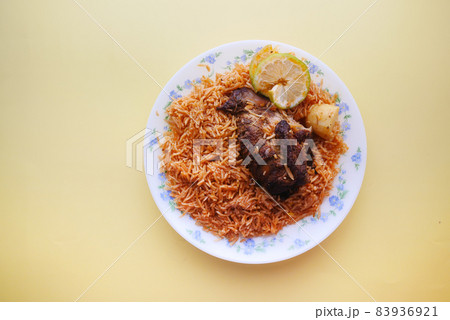 mutton biryani meal in a plate on table. mutton biryani meal in a plate on table. 83936921