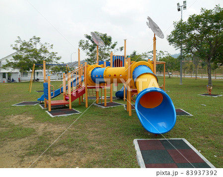 MALACCA, MALAYSIA -MAY 02, 2016: Children outdoor playground in the public park. It was design with few different themes and colorful to give different experience to the kids. MALACCA, MALAYSIA -MAY 02, 2016: Children outdoor playground in the public park. It was design with few different themes and colorful to give different experience to the kids. 83937392