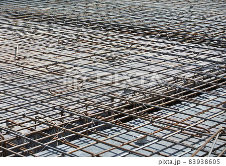 SELANGOR, MALAYSIA -MAY 13, 2016: Hot rolled deformed steel bars or steel reinforcement bars used at the construction site to strengthen concrete. It is shaped to follow the engineer's design. SELANGOR, MALAYSIA -MAY 13, 2016: Hot rolled deformed steel bars or steel reinforcement bars used at the construction site to strengthen concrete. It is shaped to follow the engineer's design. 83938605