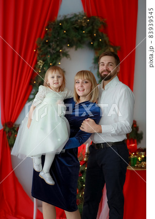 Family photo with the whole family in beautiful outfits Family photo with the whole family in beautiful outfits 83939545
