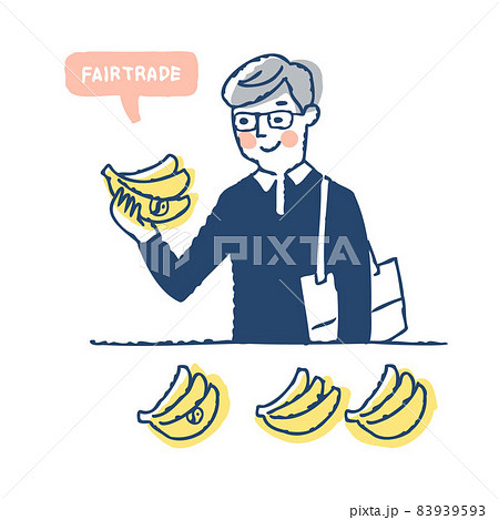 フェアトレード商品のバナナを手に取る男性 83939593