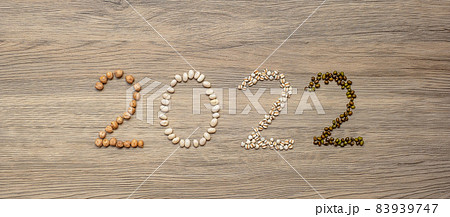 2022 New Year and New You with organic Beans; white, green, chickpeas and Adlay on table. Goals, Healthy, Motivation, Resolution, Weight loss, dieting and world food day concept 2022 New Year and New You with organic Beans; white, green, chickpeas and Adlay on table. Goals, Healthy, Motivation, Resolution, Weight loss, dieting and world food day concept 83939747