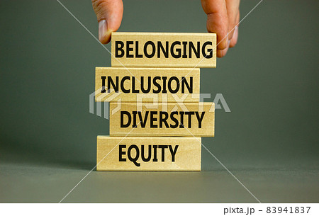 Equity, diversity, inclusion and belonging symbol. Wooden blocks with words 'equity, diversity, inclusion, belonging' on beautiful grey background. Diversity, equity, inclusion and belonging concept. 83941837