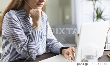 Businesswoman working with laptop at home 83943830