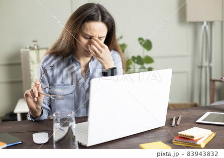 Businesswoman working with laptop at home Businesswoman working with laptop at home 83943832