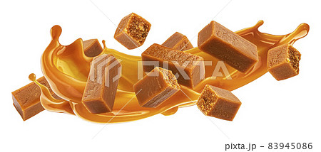 Caramel candies with caramel sauce splash isolated on white background Caramel candies with caramel sauce splash isolated on white background 83945086