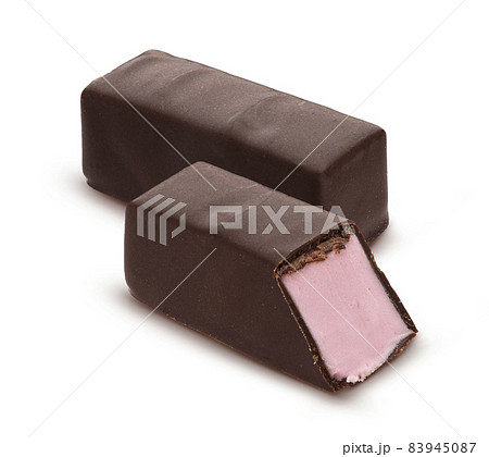 Chocolate candies with strawberry souffle isolated on white Chocolate candies with strawberry souffle isolated on white 83945087
