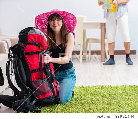 Young active pair preparing for honeymoon trip Young active pair preparing for honeymoon trip 83951444