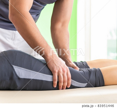 Young doctor chiropractor massaging patient Young doctor chiropractor massaging patient 83951446