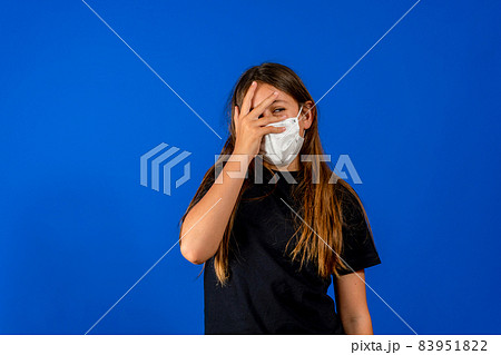 Masked Child. Portrait Little Girl. Serious girl. Protective Mask from viruses covid-19, flu. Basic hygiene rules. Take care of yourself and your loved ones. Be healthy. Healthier Kids for Our Future Masked Child. Portrait Little Girl. Serious girl. Protective Mask from viruses covid-19, flu. Basic hygiene rules. Take care of yourself and your loved ones. Be healthy. Healthier Kids for Our Future 83951822