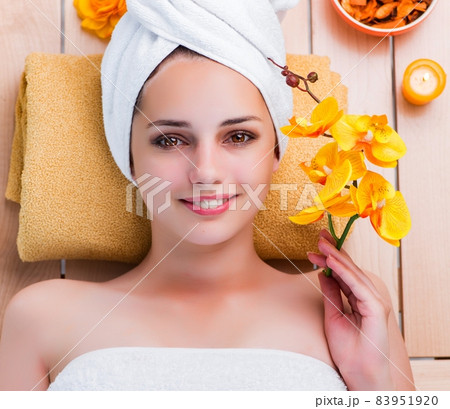 Young woman in spa health concept 83951920