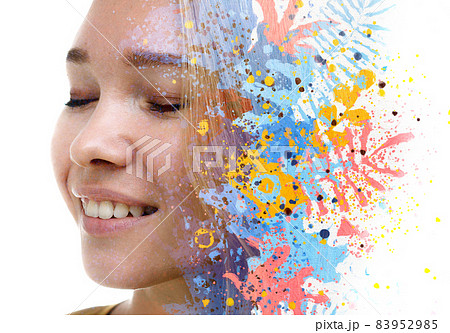 A portrait of a woman combined with colorful leaves in a double exposure technique. 83952985