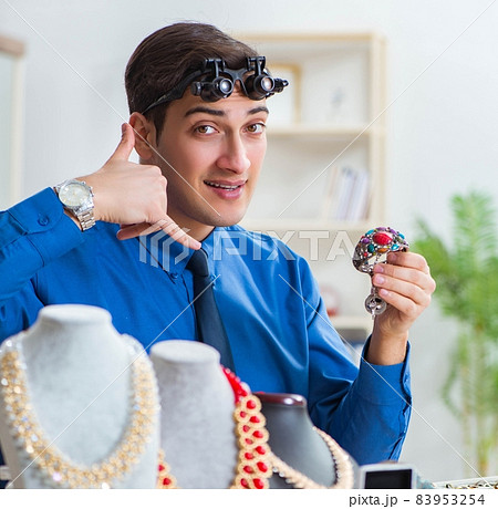 Jeweler working with luxury jewelry in the workshop Jeweler working with luxury jewelry in the workshop 83953254