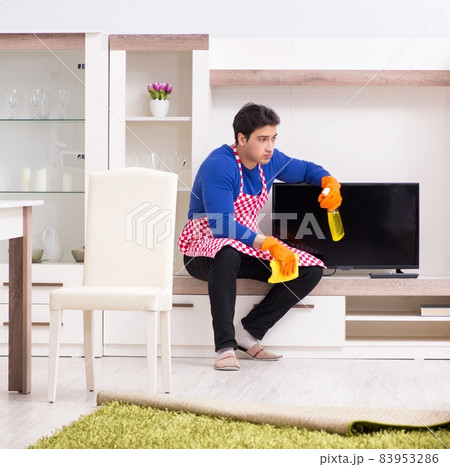 Contractor man cleaning house doing chores 83953286