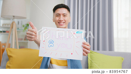 man holding thank you billboard 83954767