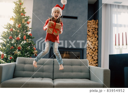 girl with Christmas gift girl with Christmas gift 83954952