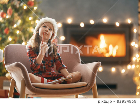 girl is writing the letter to Santa girl is writing the letter to Santa 83954959